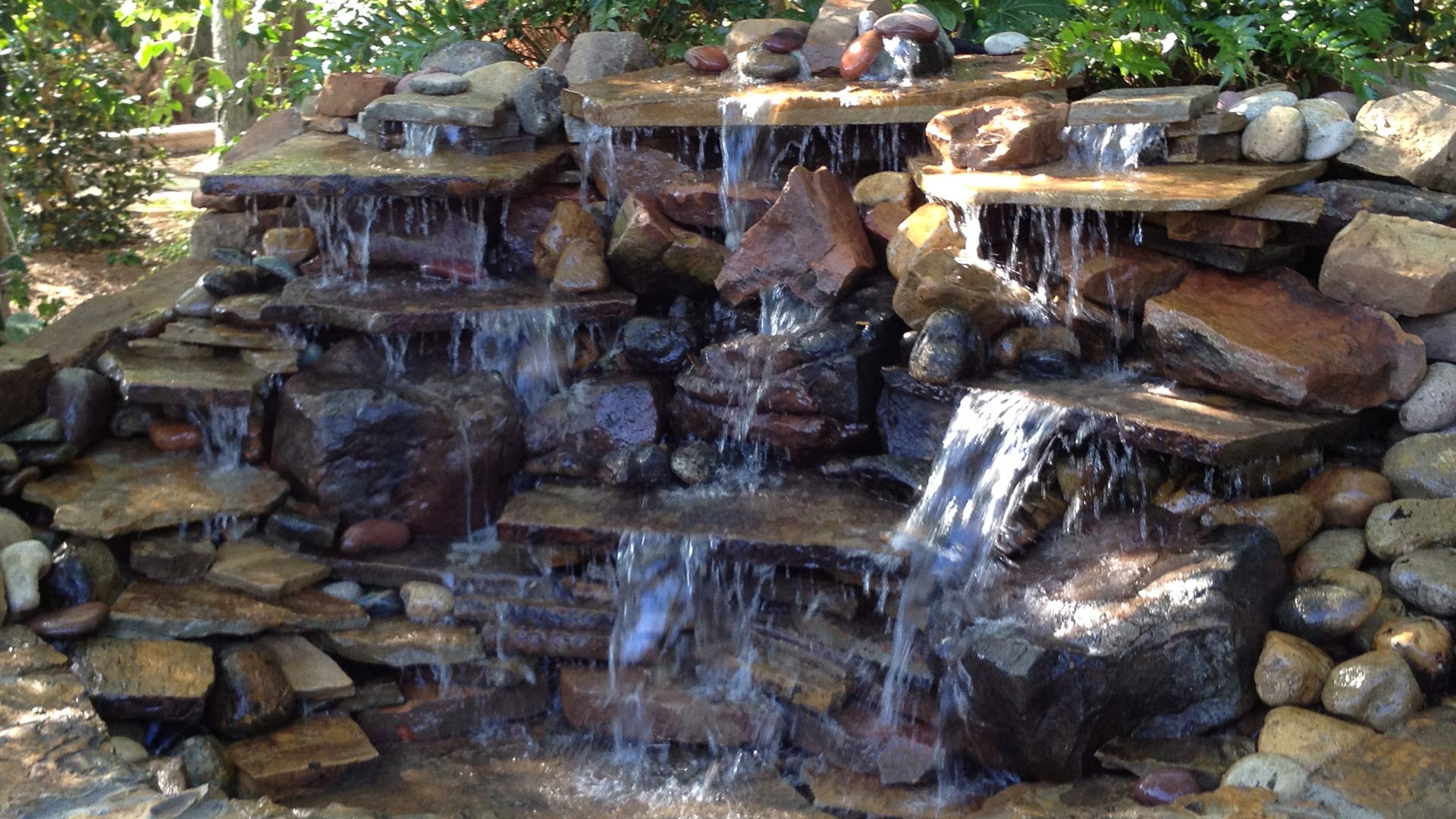 Waterfall water feature installed for landscape in China Spring, TX.