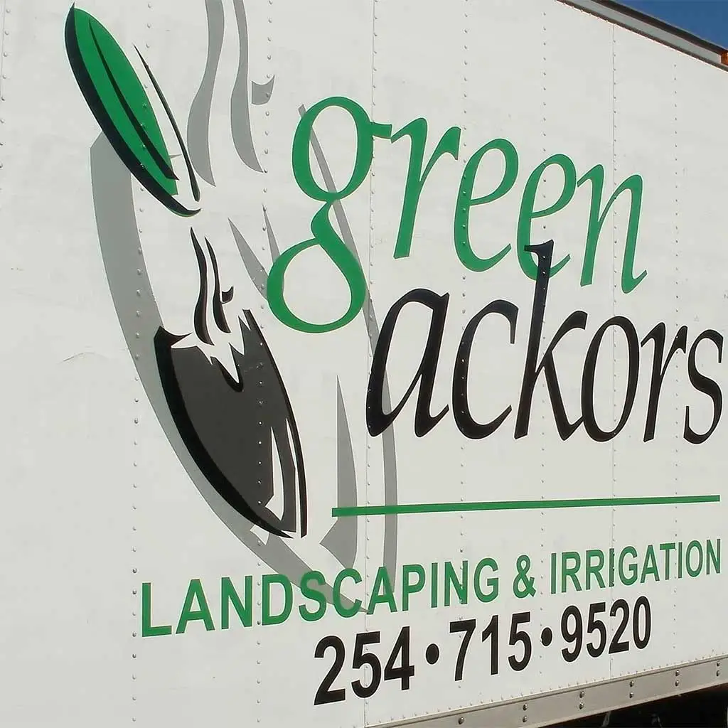 Green Ackors Landscaping & Irrigation service truck in Waco, TX.