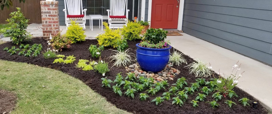 Mulching and plantings installed for front yards' landscape bed in China Spring, TX.