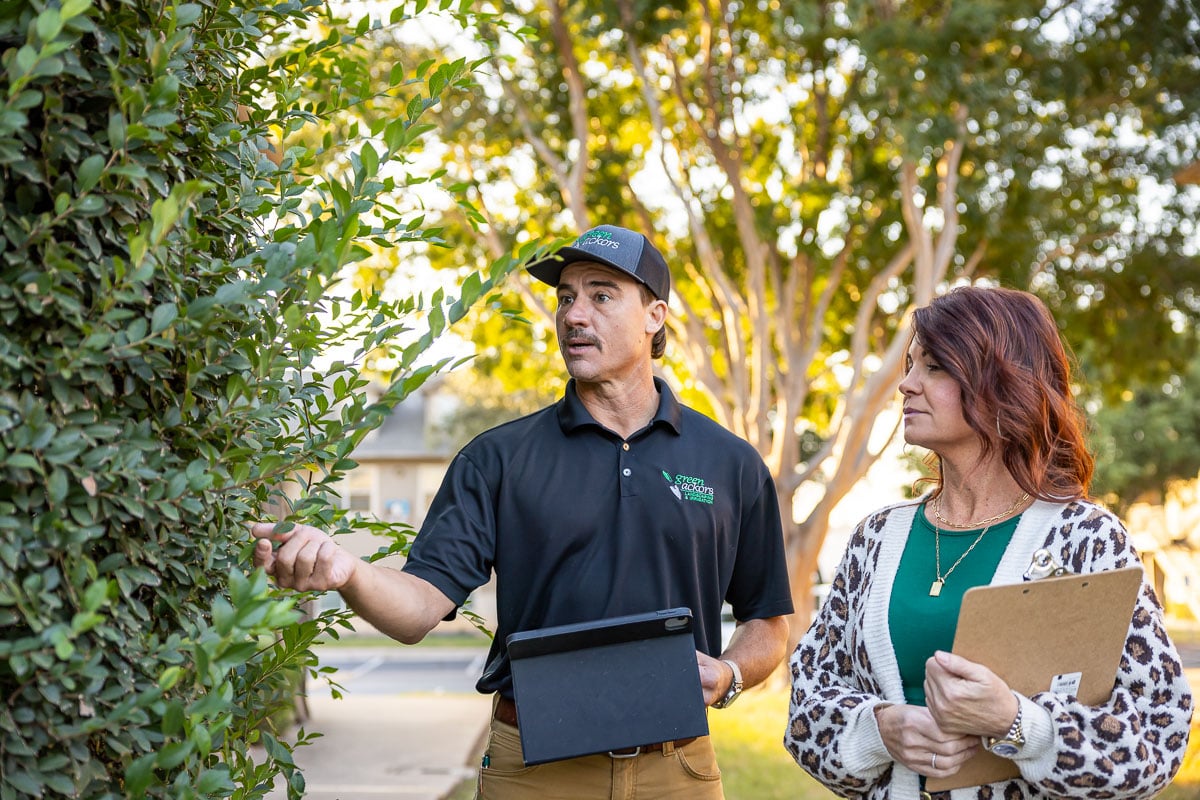 Account manager and property manager walking inspection apartment complex 6