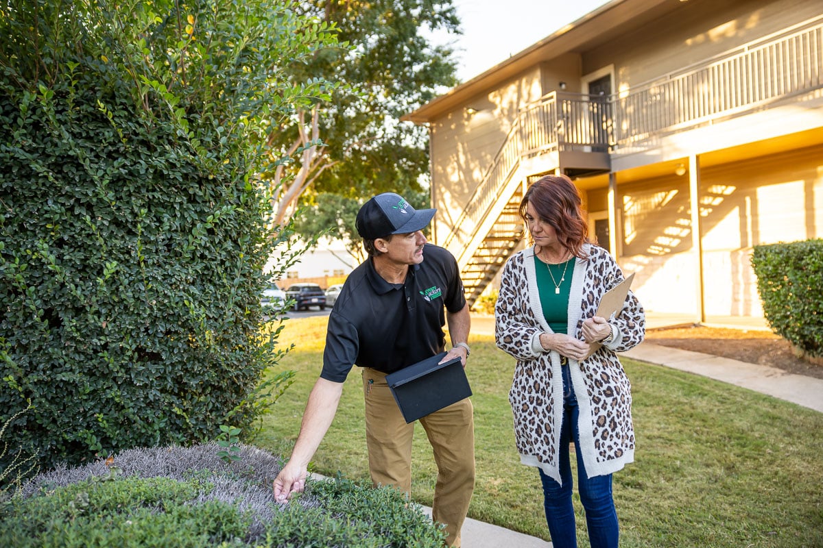 Account manager and property manager walking inspection apartment complex 9