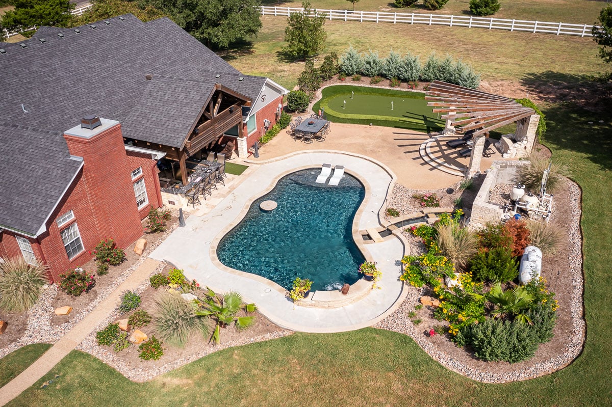 Aerial view landscape design backyard pool golf green patio