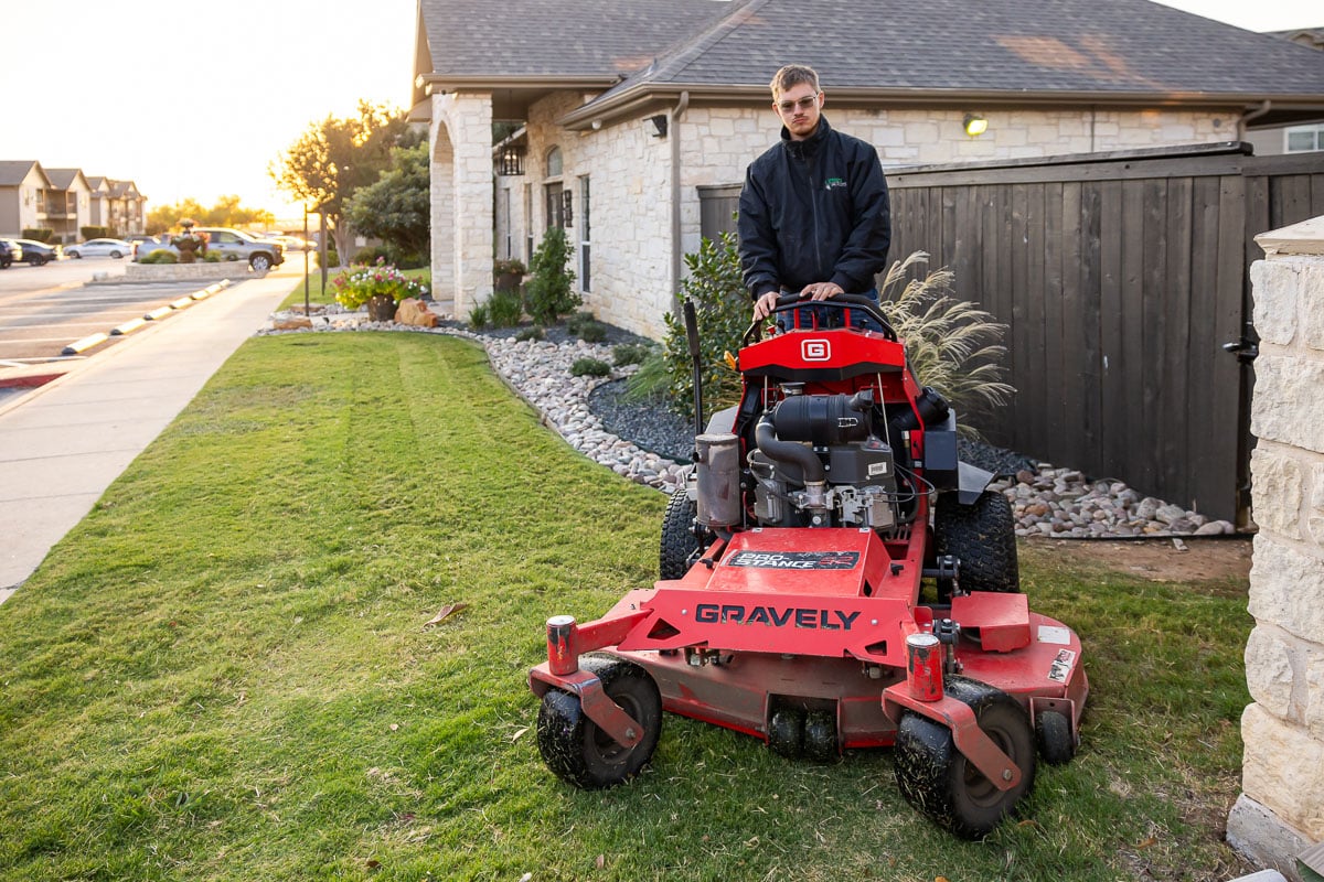 Commercial maintenance apartment complex crew mowing 12