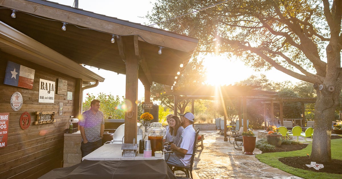 Outdoor kitchen family customer cooking pergola patio backyard landscape beds 
