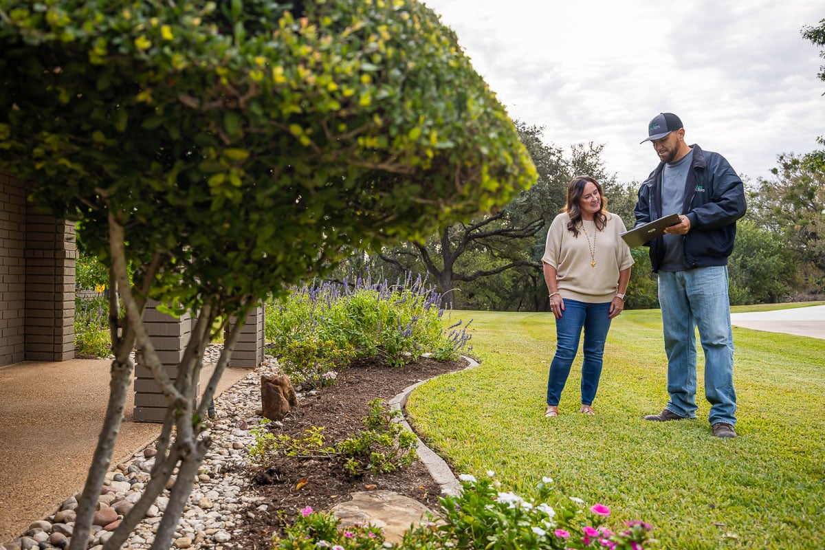 Residential landscape maintenance Account manager and customer doing inspection 2