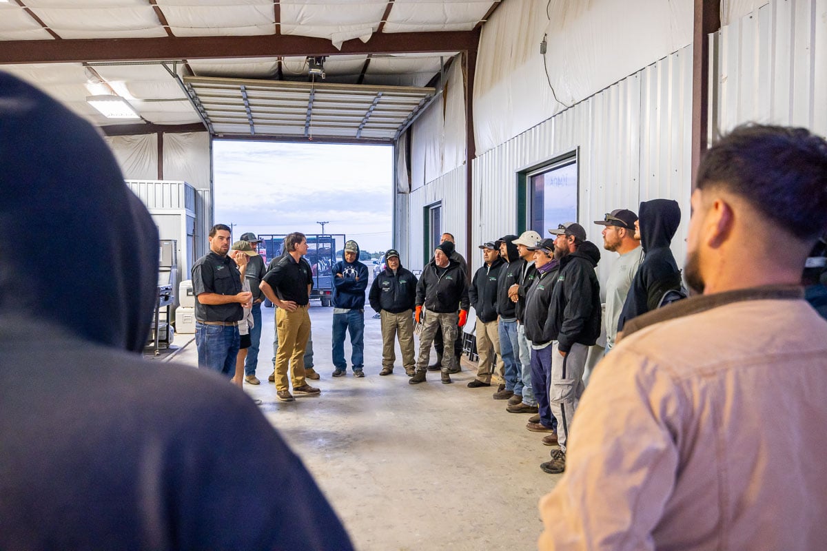 Shop crew in office meeting 1
