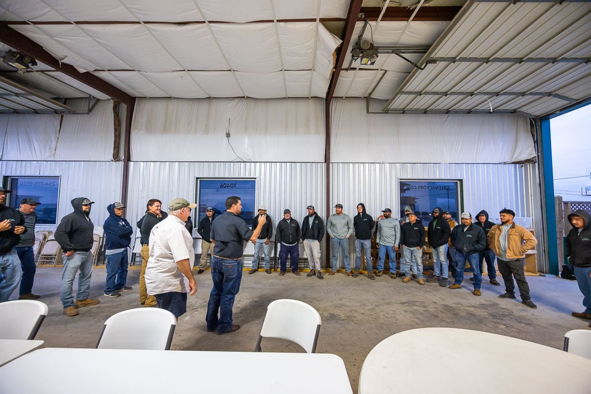 Shop crew in office meeting