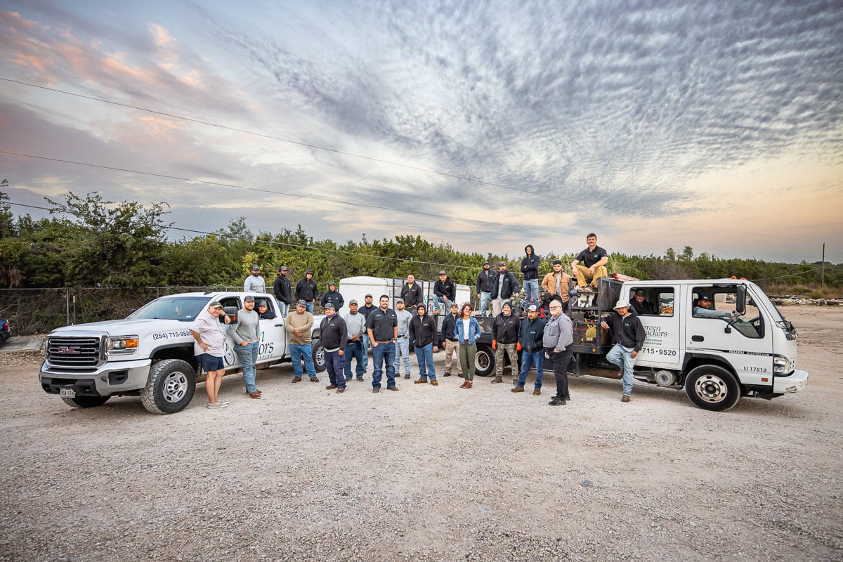 Shop crew in office team photo 1