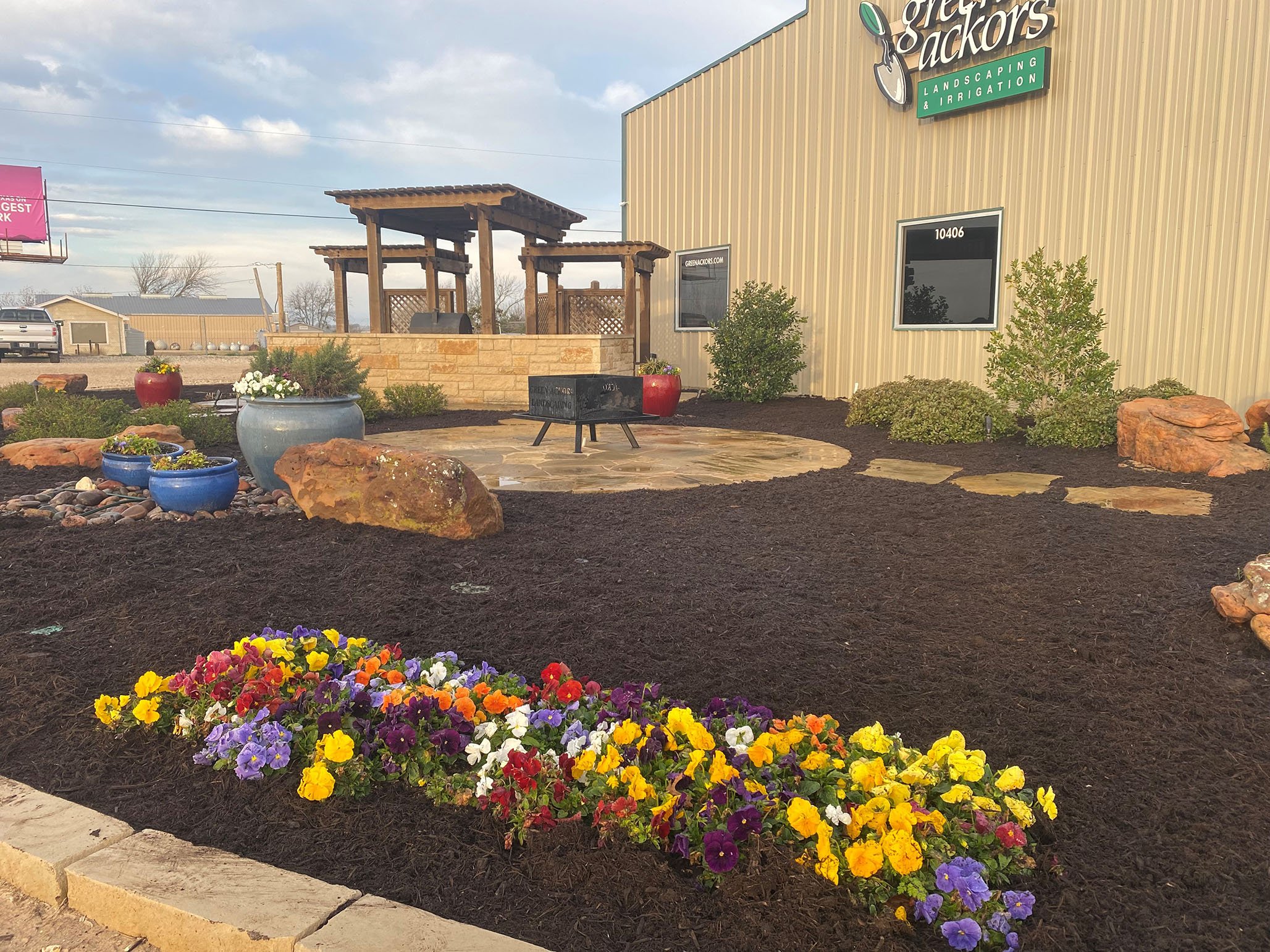 flowers annuals boulder stone steppers patio firepit pergola pots shrubs green ackors front