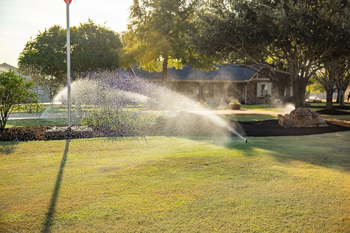 front of house green lawn landscape beds irrigation watering 5