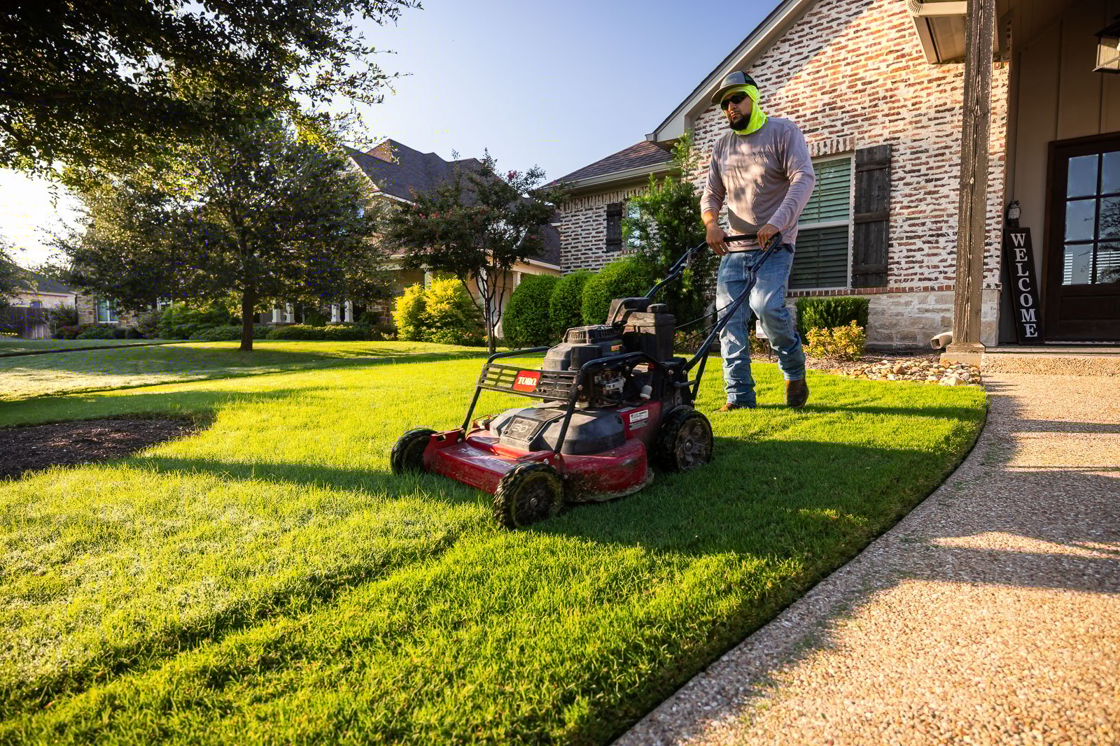 front of house landscaping crew maintenance mowing lawn 9