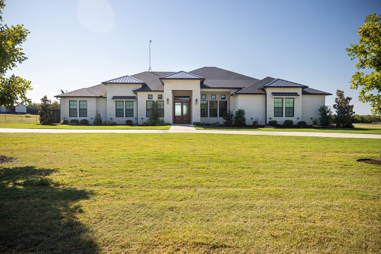 front of house large green lawn landscape beds 1