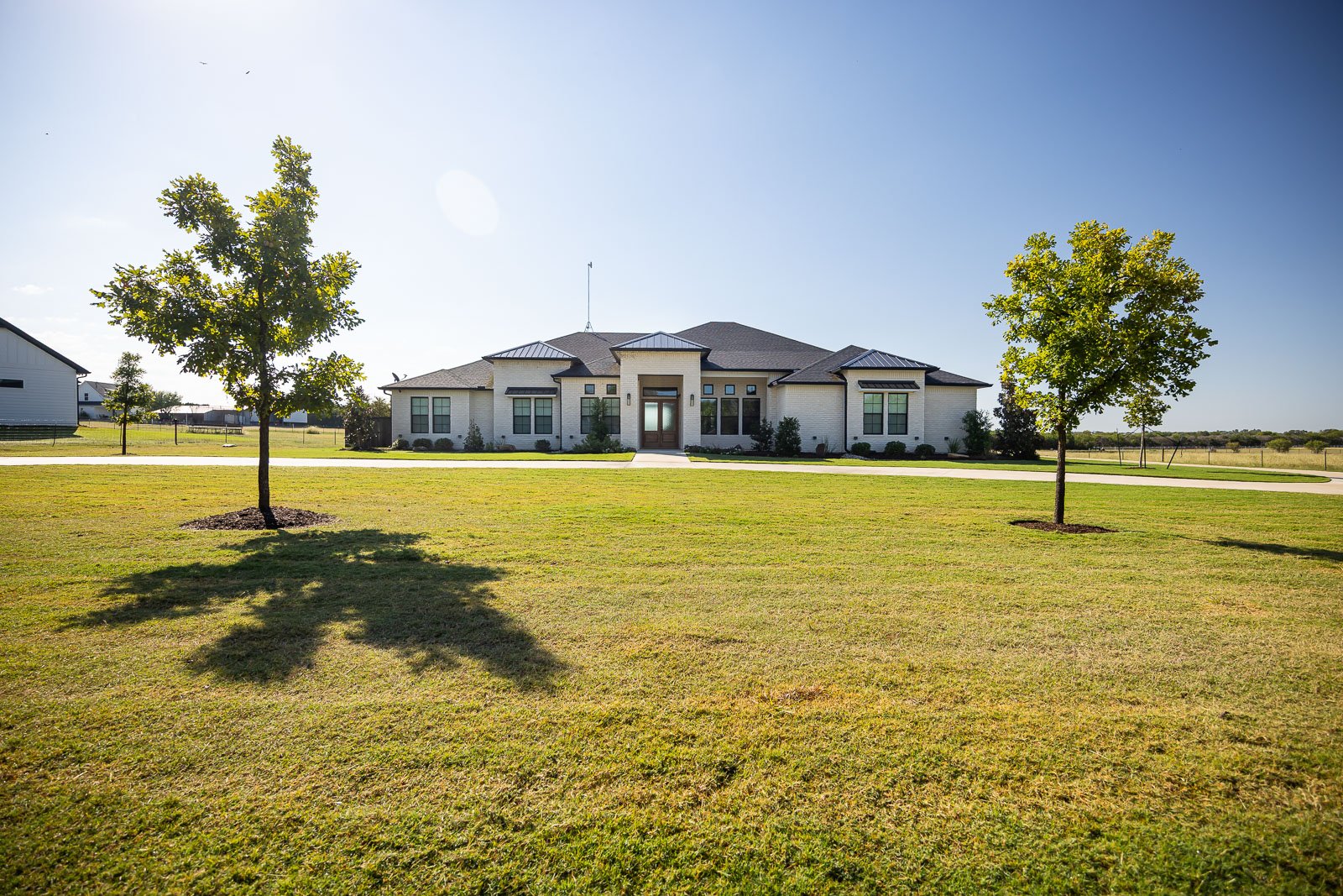 front of house large green lawn landscape beds 2