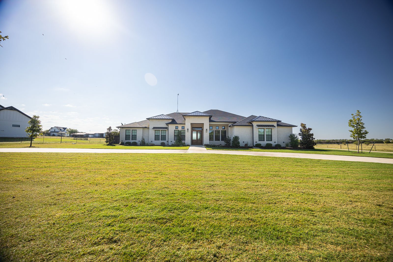 front of house large green lawn landscape beds
