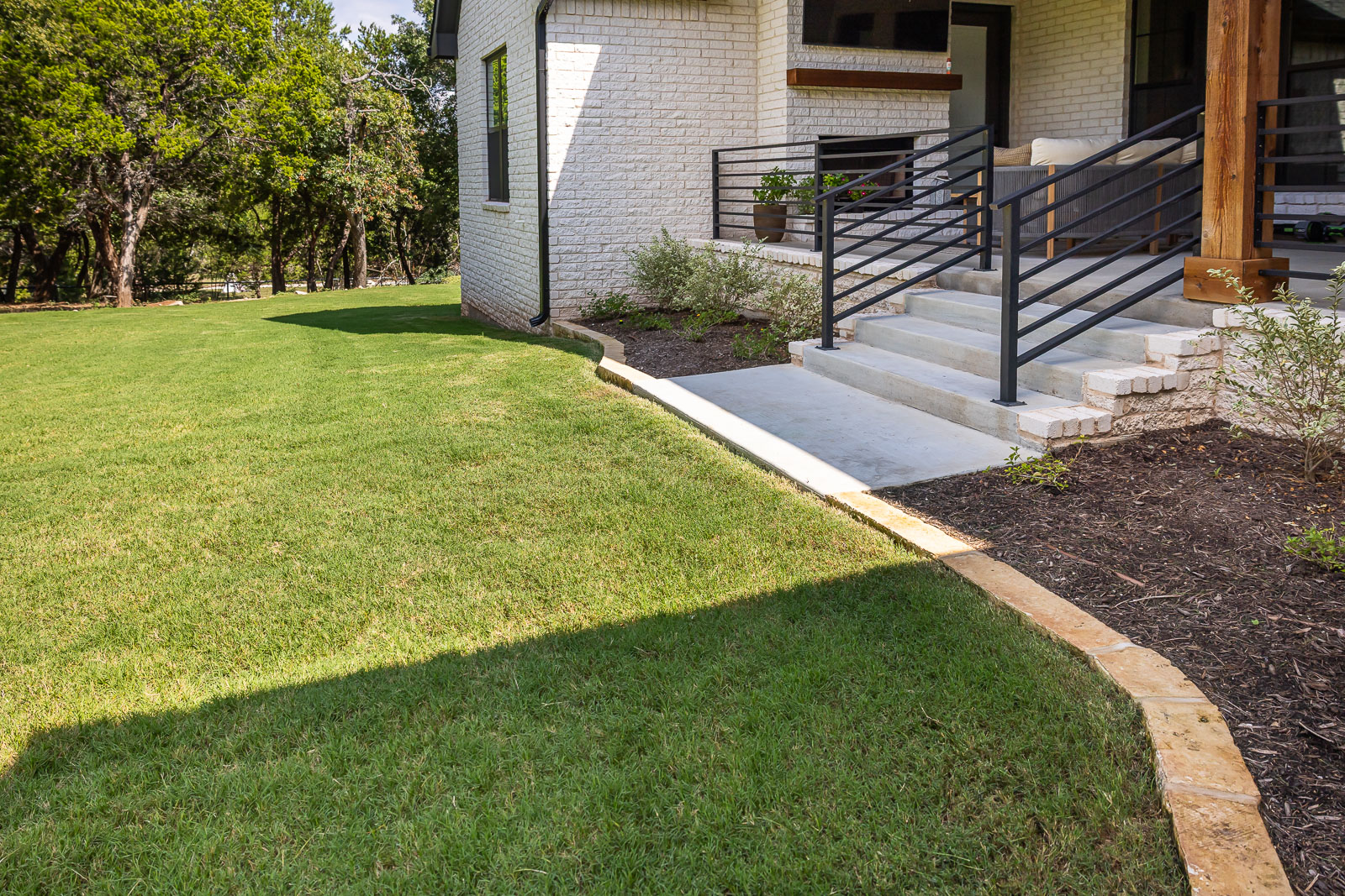 green lawn backyard landscape beds