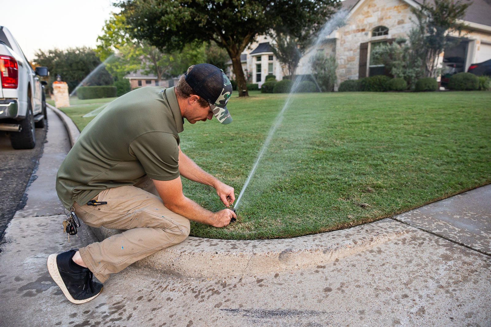 irrigation maintenance crew watering lawn 3