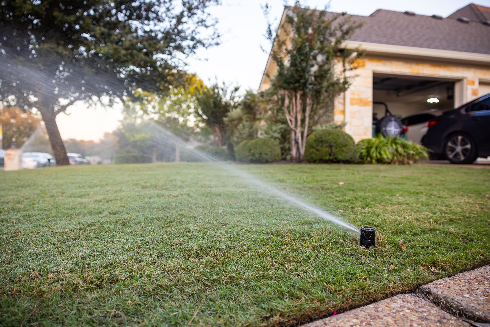 irrigation system watreing lawn green grass