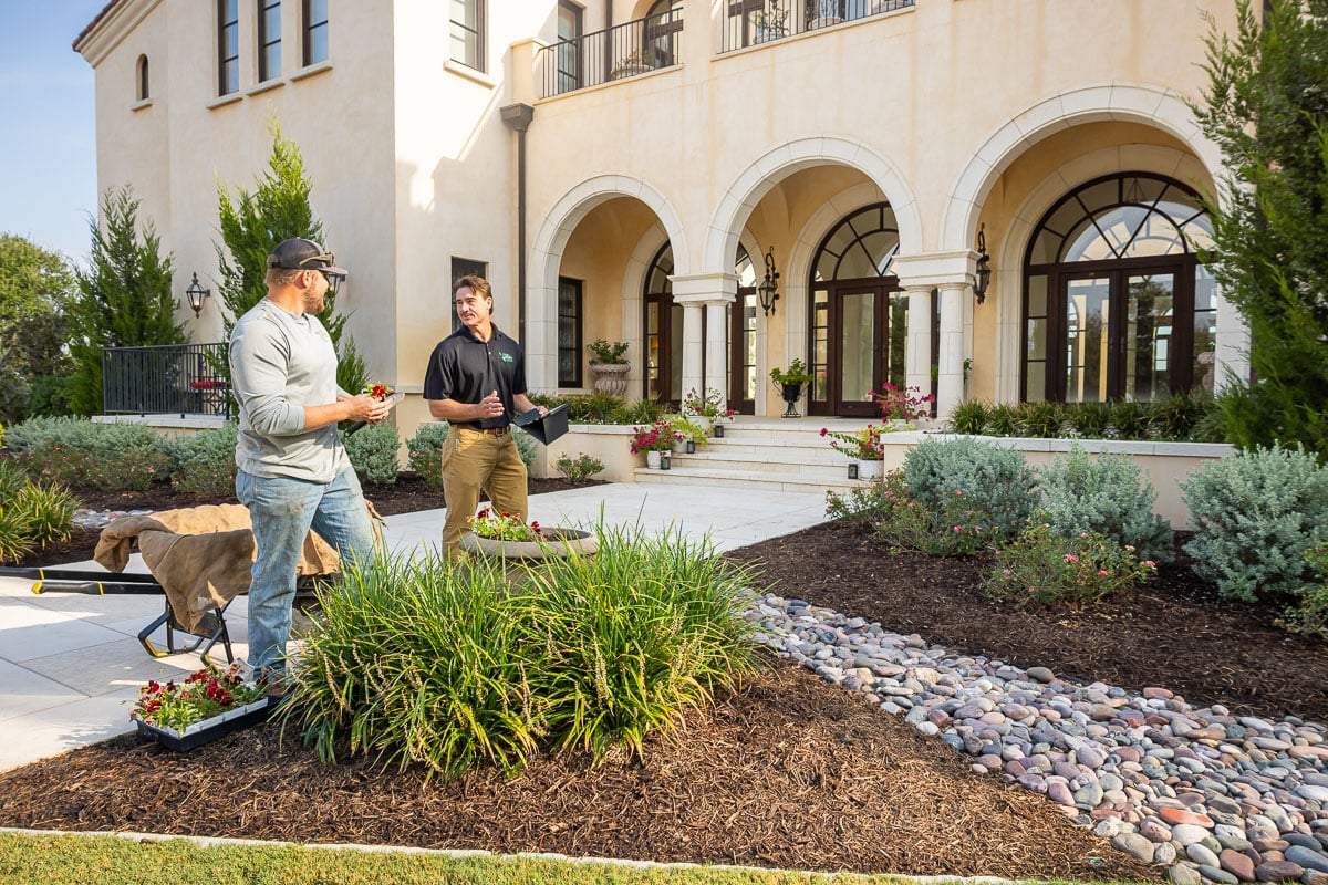 residential property landscape crew annual plantings with acciount manager landscape beds 
