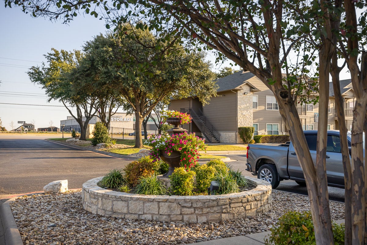 Commercial apartment complex landscape beds trees 20