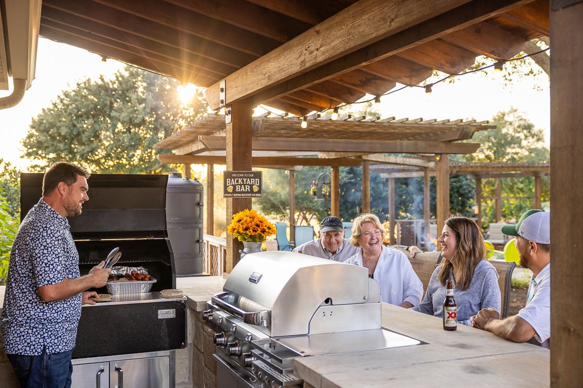 Outdoor kitchen cooking family customer pergola backyard