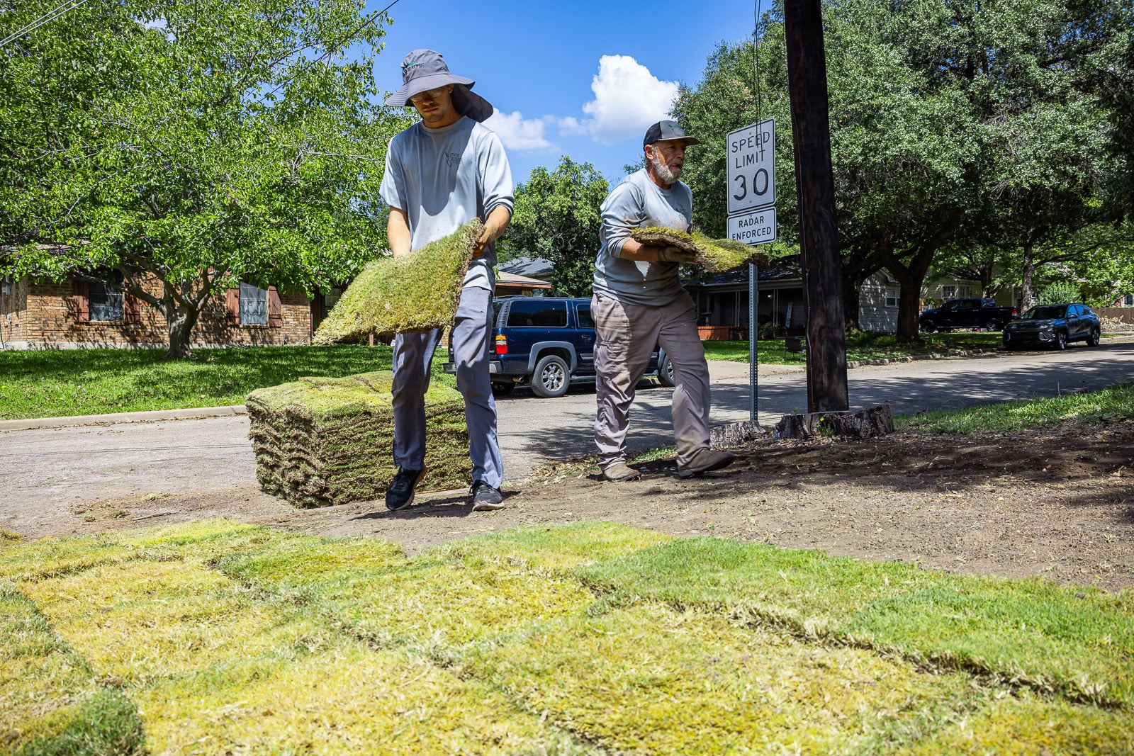 https://47688315.fs1.hubspotusercontent-na1.net/hubfs/47688315/Residential%20maintenance%20crew%20laying%20sod%201.jpg