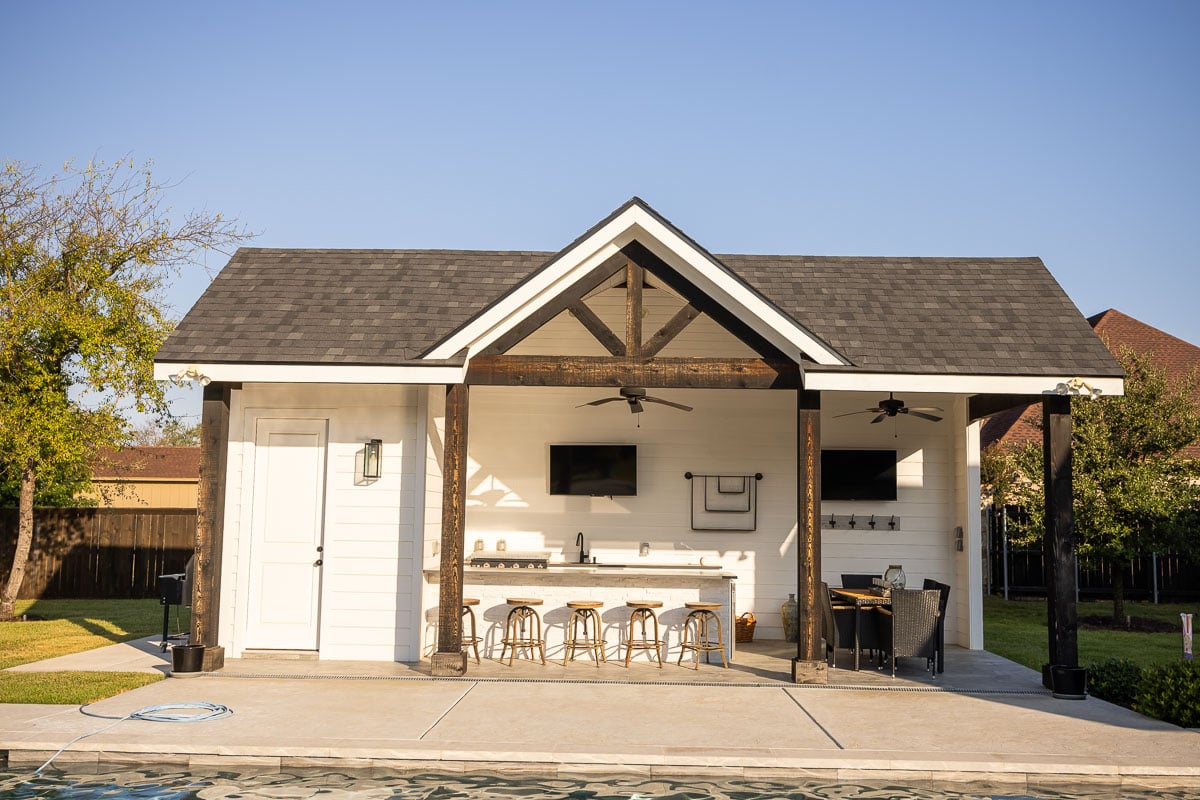 Residential pool house outdoor kitchen patio landscape