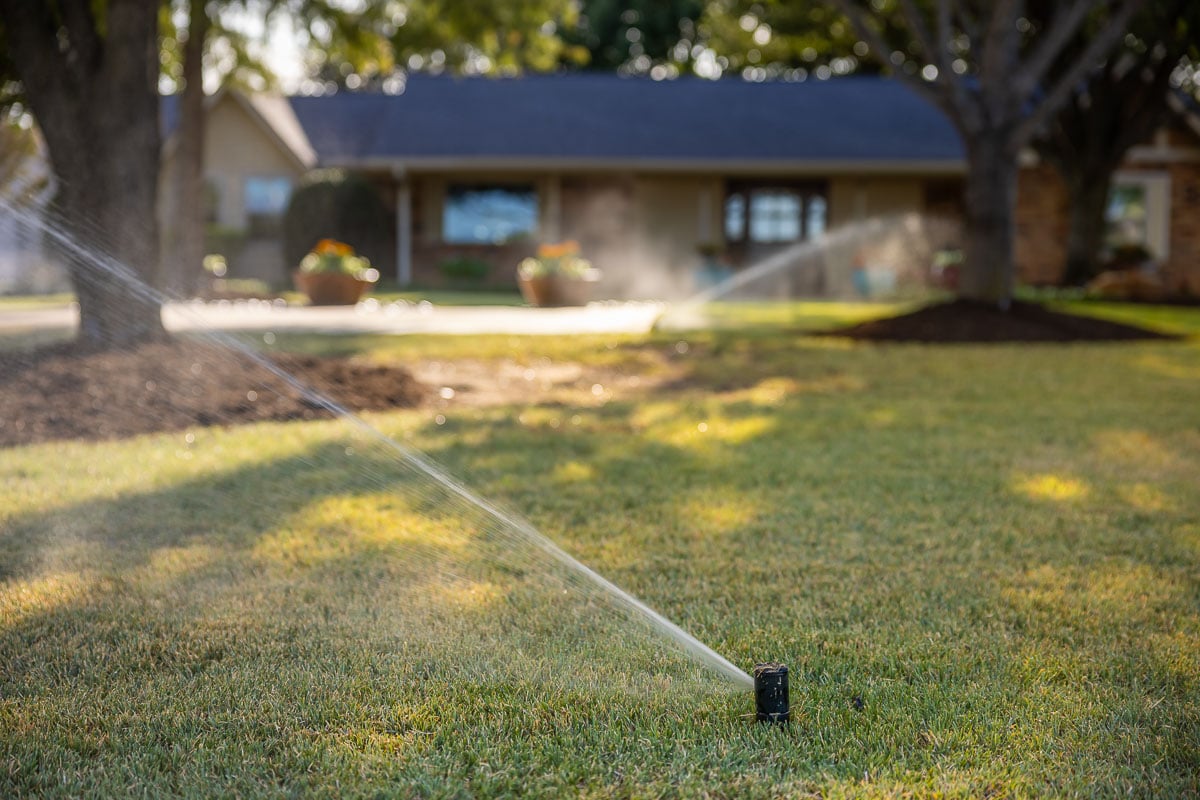 front of house green lawn landscape beds irrigation watering 3