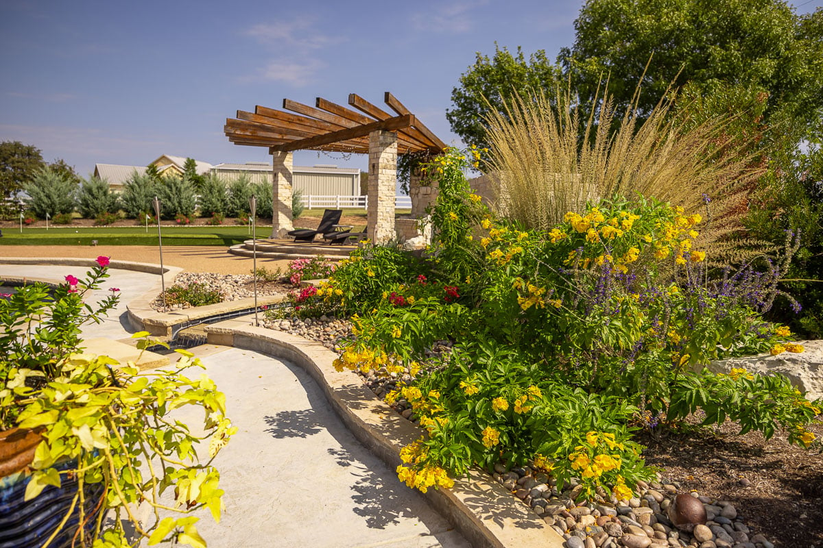 pergola landscape beds flowers putting green patio 