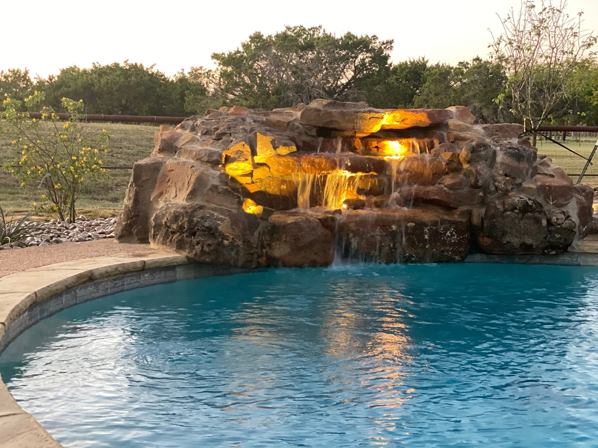 water feature lighting waterfall pool stone boulders