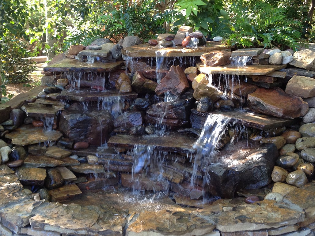 waterfall stone boulder water feature